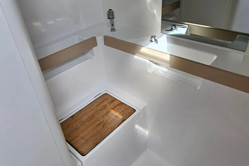  Yacht Photos Pics Bathroom interior of 2024 Beneteau Oceanis 38.1 yacht, featuring sleek design and modern fixtures.