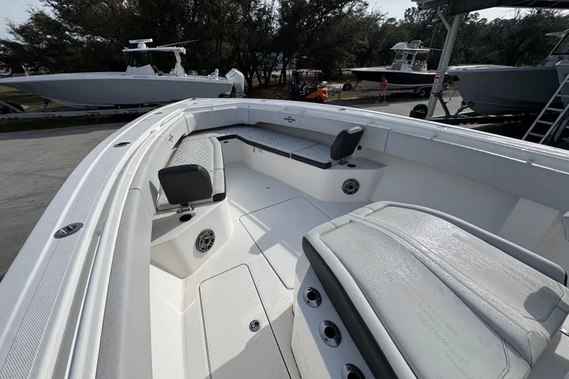  Yacht Photos Pics 2023 Fountain 38 Tournament Edition boat interior with seating and speakers.