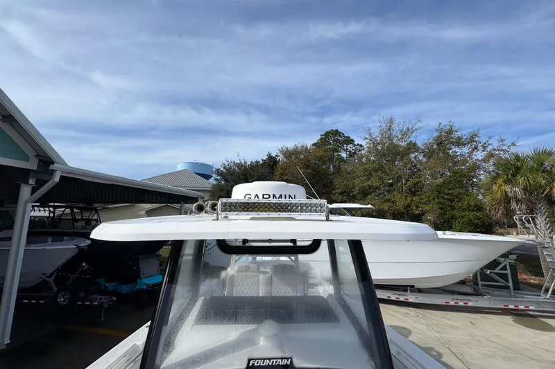  Yacht Photos Pics 2023 Fountain 38 Tournament Edition boat with Garmin equipment, parked outdoors.