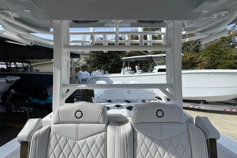  Yacht Photos Pics 2023 Fountain 38 Tournament Edition boat interior with luxurious seating and sleek design.
