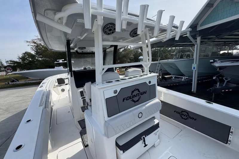  Yacht Photos Pics 2023 Fountain 38 Tournament Edition boat interior with rod holders and seating.