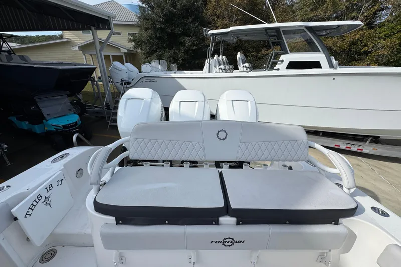  Yacht Photos Pics 2023 Fountain 38 Tournament Edition boat with triple engines, docked outdoors.