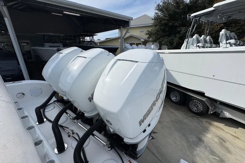  Yacht Photos Pics 2023 Fountain 38 Tournament Edition with triple Mercury outboard engines in a boatyard.