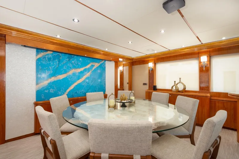 Mojito Yacht Photos Pics Luxurious dining area on 2006 Hargrave Raised Pilothouse yacht with elegant decor and round table.