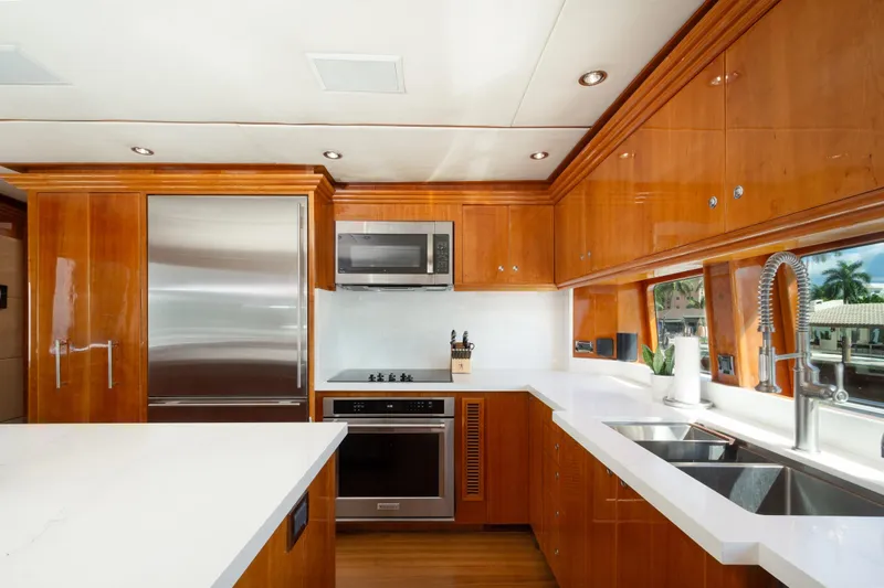 Mojito Yacht Photos Pics Luxurious 2006 Hargrave Raised Pilothouse yacht kitchen with modern appliances and sleek wood cabinetry.