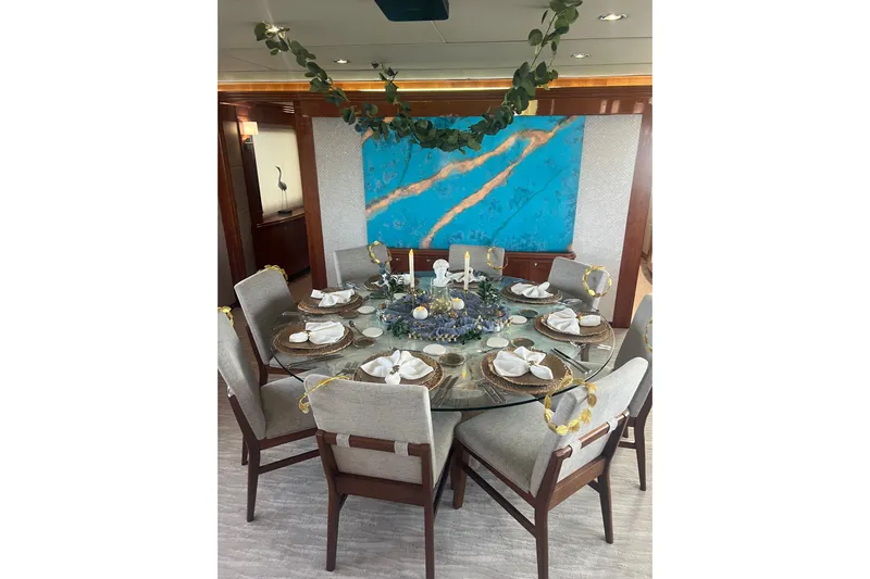 Mojito Yacht Photos Pics Luxurious dining area on 2006 Hargrave Raised Pilothouse yacht with elegant table setting.
