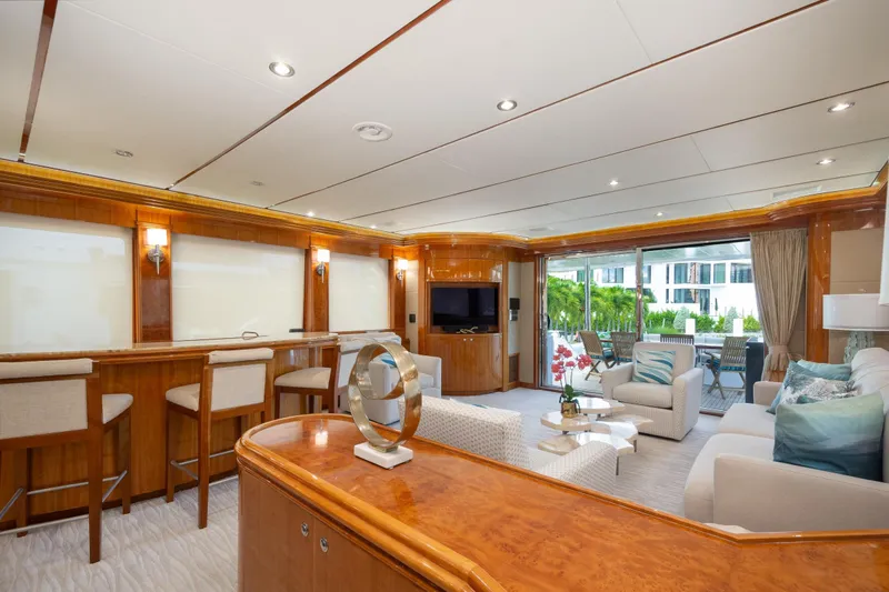 Mojito Yacht Photos Pics Luxurious interior of 2006 Hargrave Raised Pilothouse yacht with elegant seating and bar area.