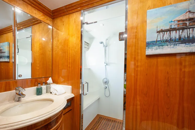 Mojito Yacht Photos Pics Luxurious bathroom in 2006 Hargrave Raised Pilothouse yacht with wood paneling and modern shower.