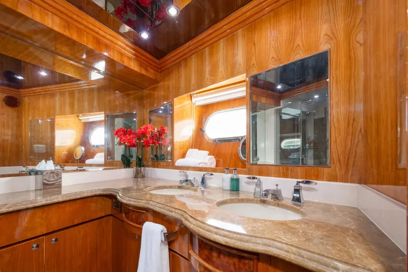 Mojito Yacht Photos Pics Luxurious bathroom in 2006 Hargrave Raised Pilothouse yacht with wood paneling and marble countertop.