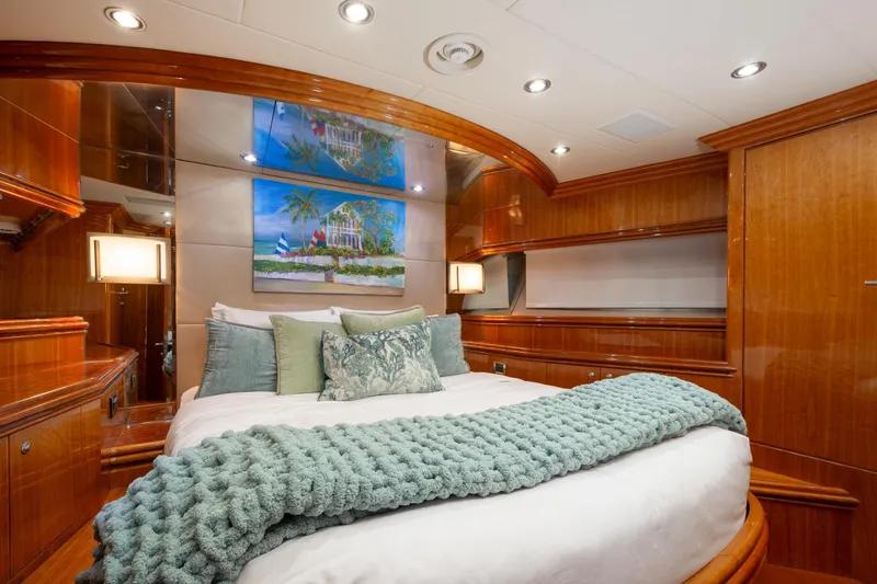 Mojito Yacht Photos Pics Luxurious bedroom interior on 2006 Hargrave Raised Pilothouse yacht with elegant wood finishes.