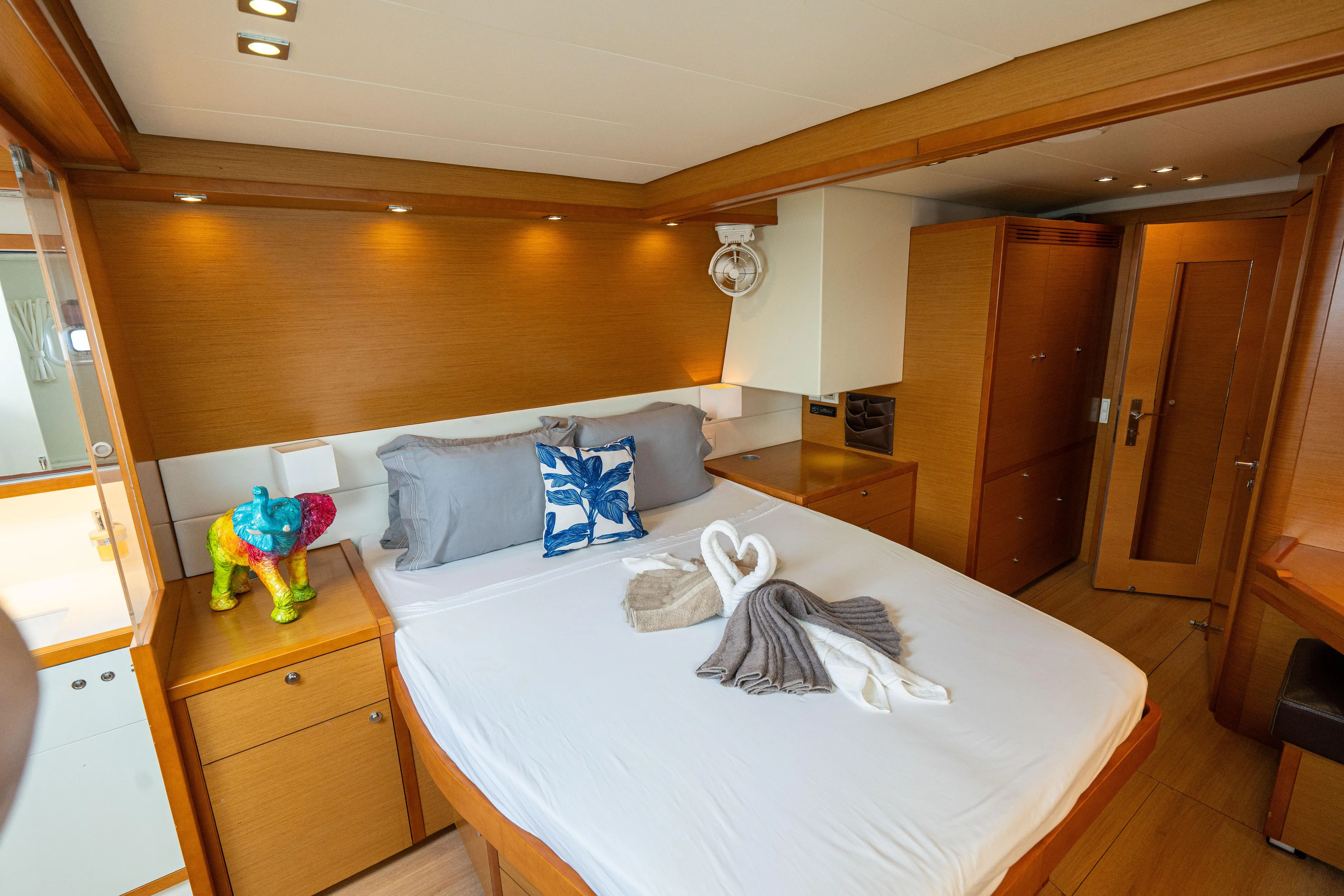 LibertÉ Yacht Photos Pics Luxurious cabin interior of 2011 Lagoon 560 yacht with elegant bedding and decor.