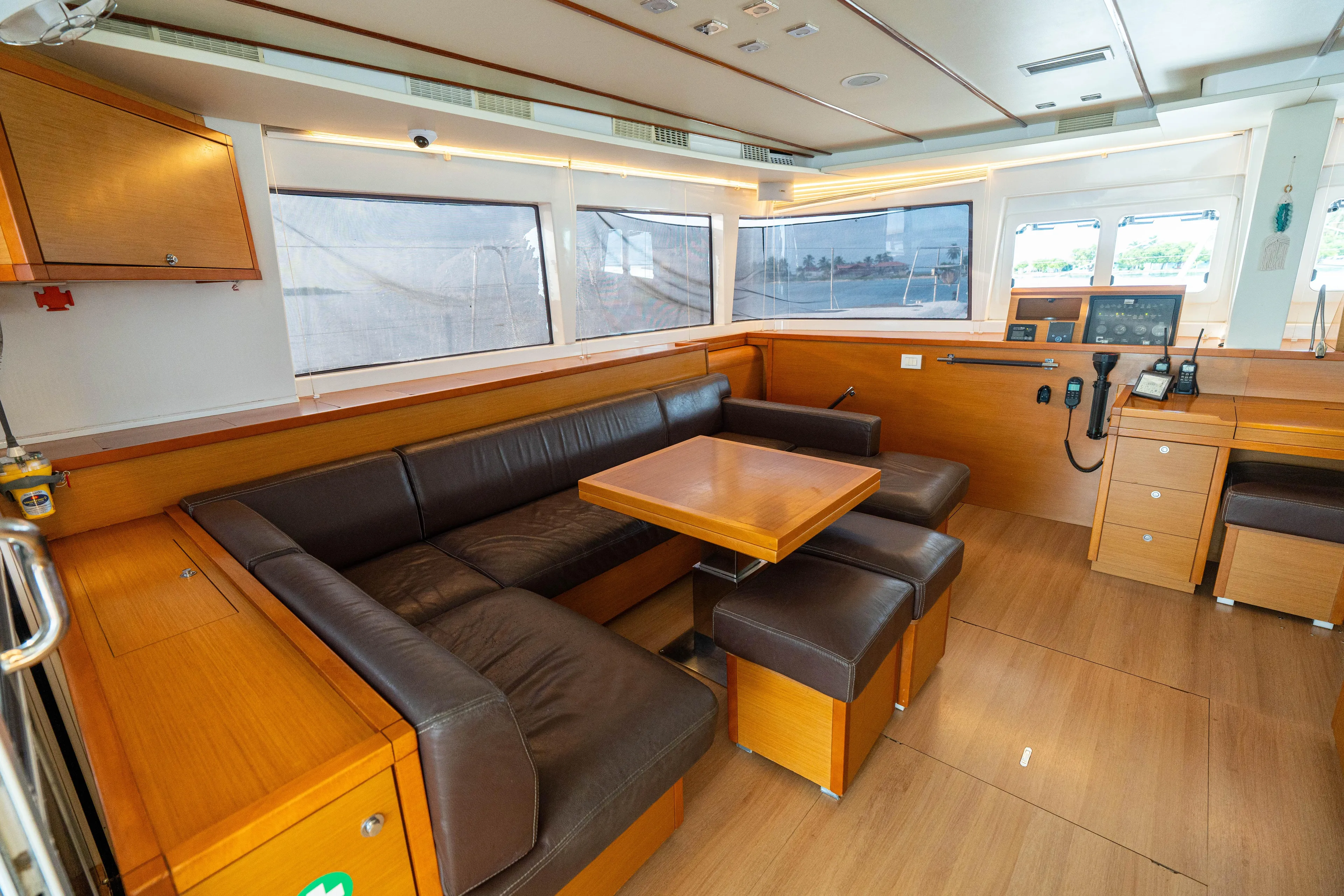 LibertÉ Yacht Photos Pics Luxurious interior of 2011 Lagoon 560 yacht with leather seating and wooden finishes.