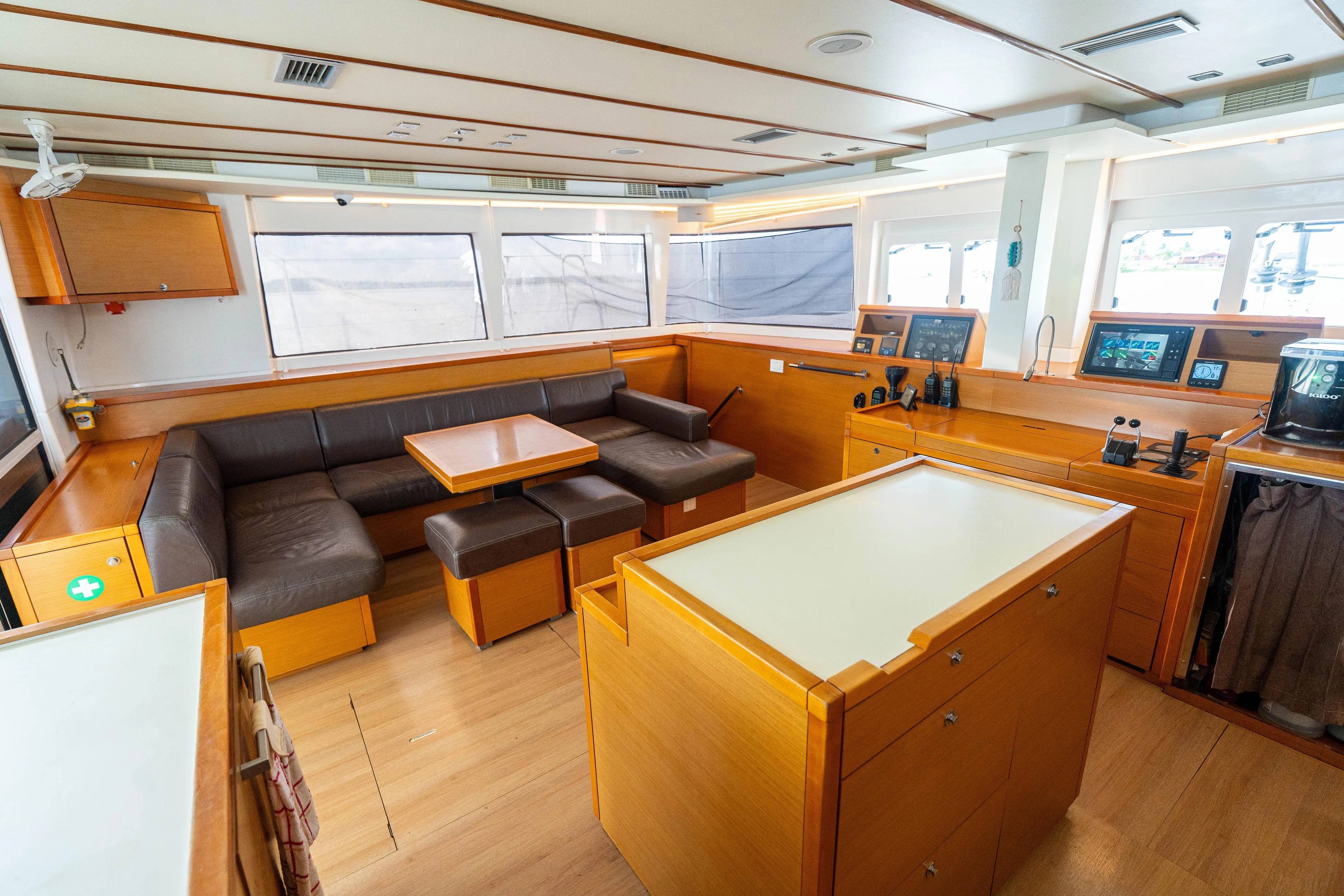 LibertÉ Yacht Photos Pics Spacious interior of 2011 Lagoon 560 yacht with modern seating and navigation area.