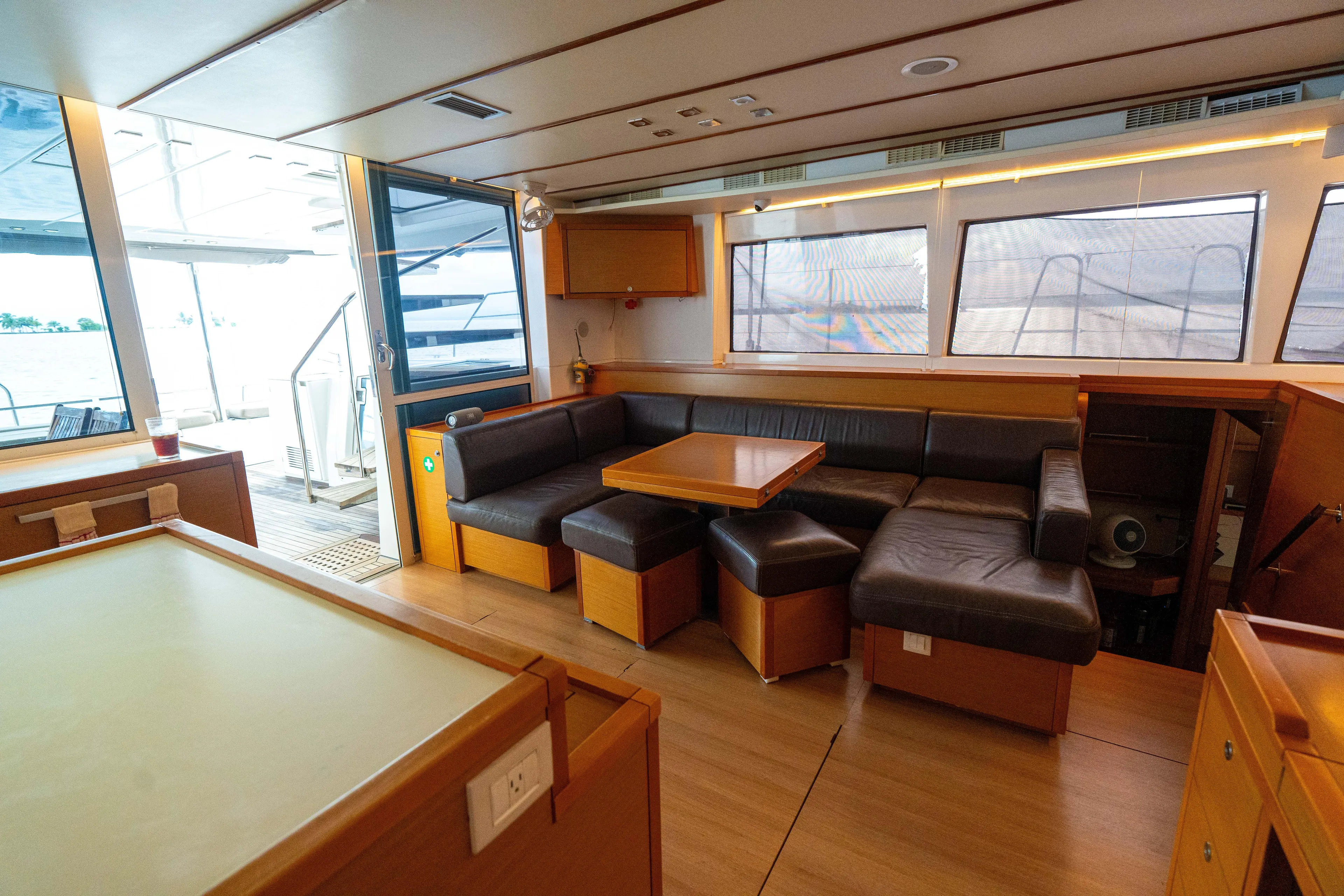 LibertÉ Yacht Photos Pics Interior of 2011 Lagoon 560 yacht with modern seating and wooden accents.