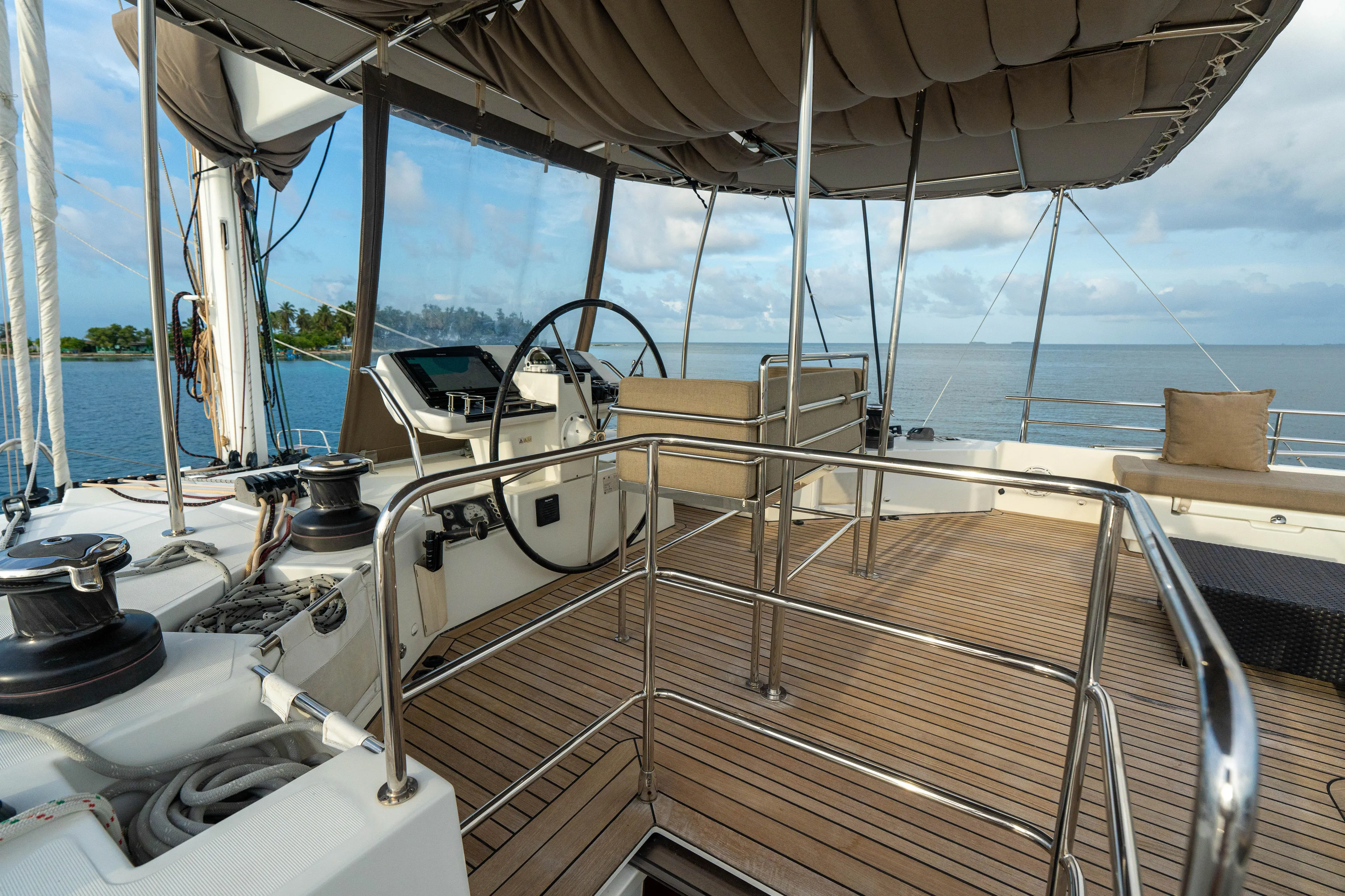 LibertÉ Yacht Photos Pics Helm of 2011 Lagoon 560 catamaran with ocean view and teak deck.