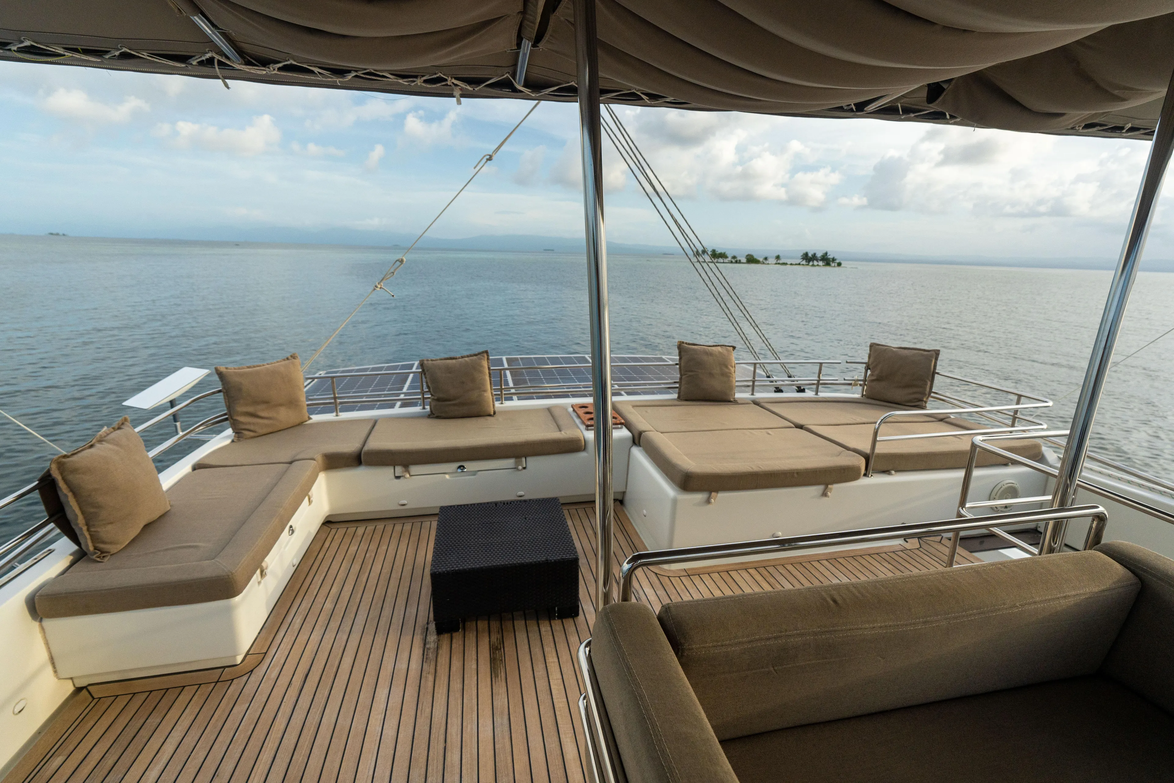 LibertÉ Yacht Photos Pics Luxurious 2011 Lagoon 560 yacht deck with comfortable seating and ocean view.