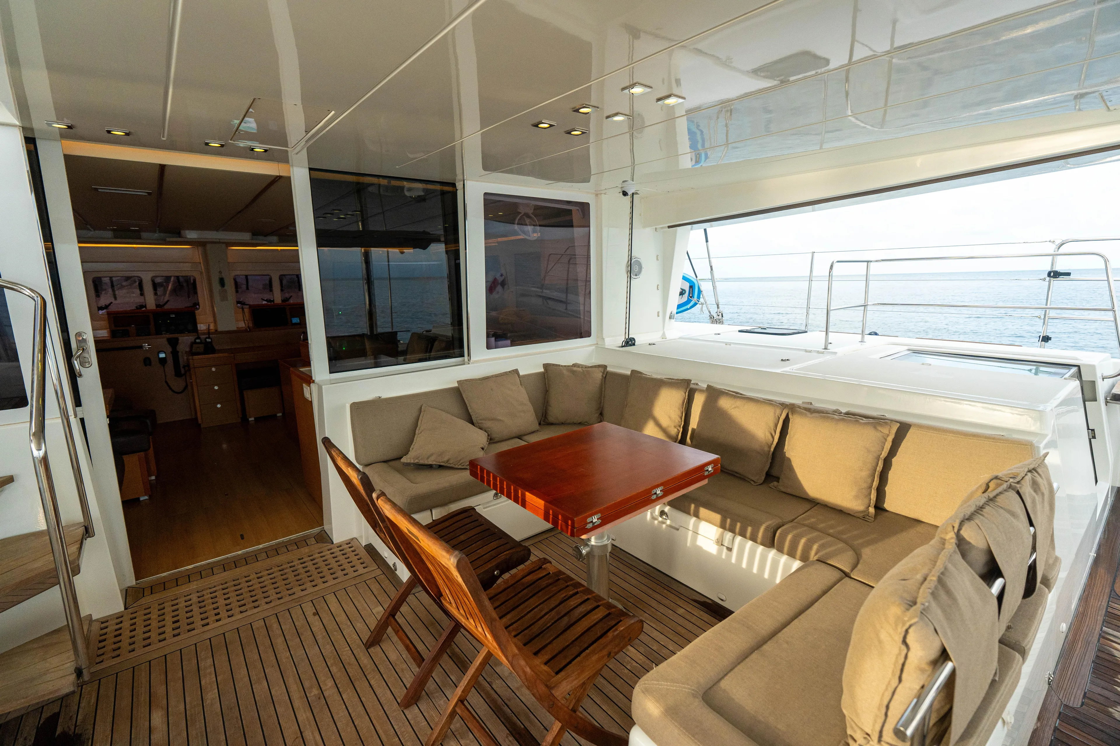 LibertÉ Yacht Photos Pics Luxurious Lagoon 560 yacht interior with cozy seating and wooden table, 2011 model.