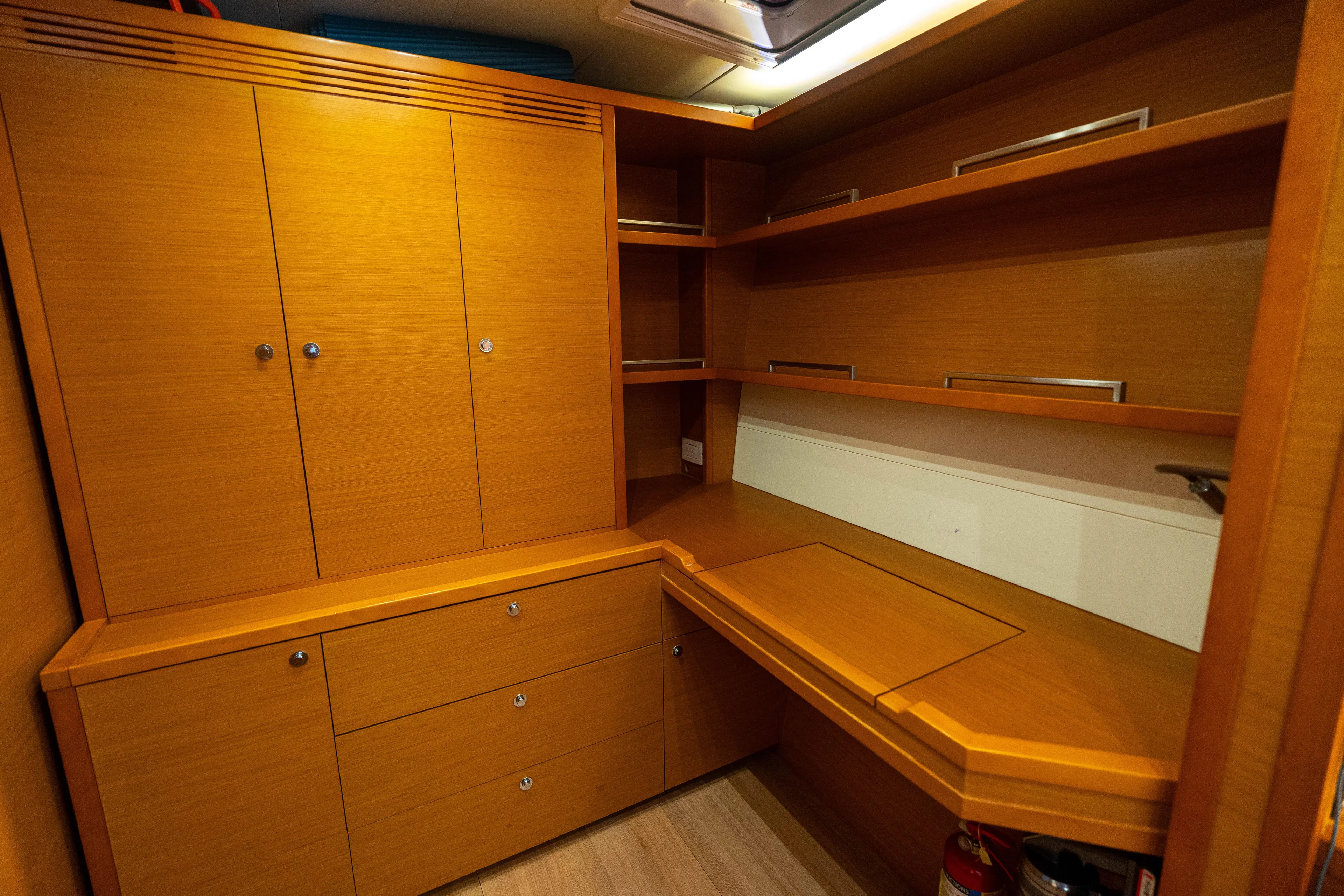 LibertÉ Yacht Photos Pics Luxurious wooden interior of a 2011 Lagoon 560 yacht with ample storage space.