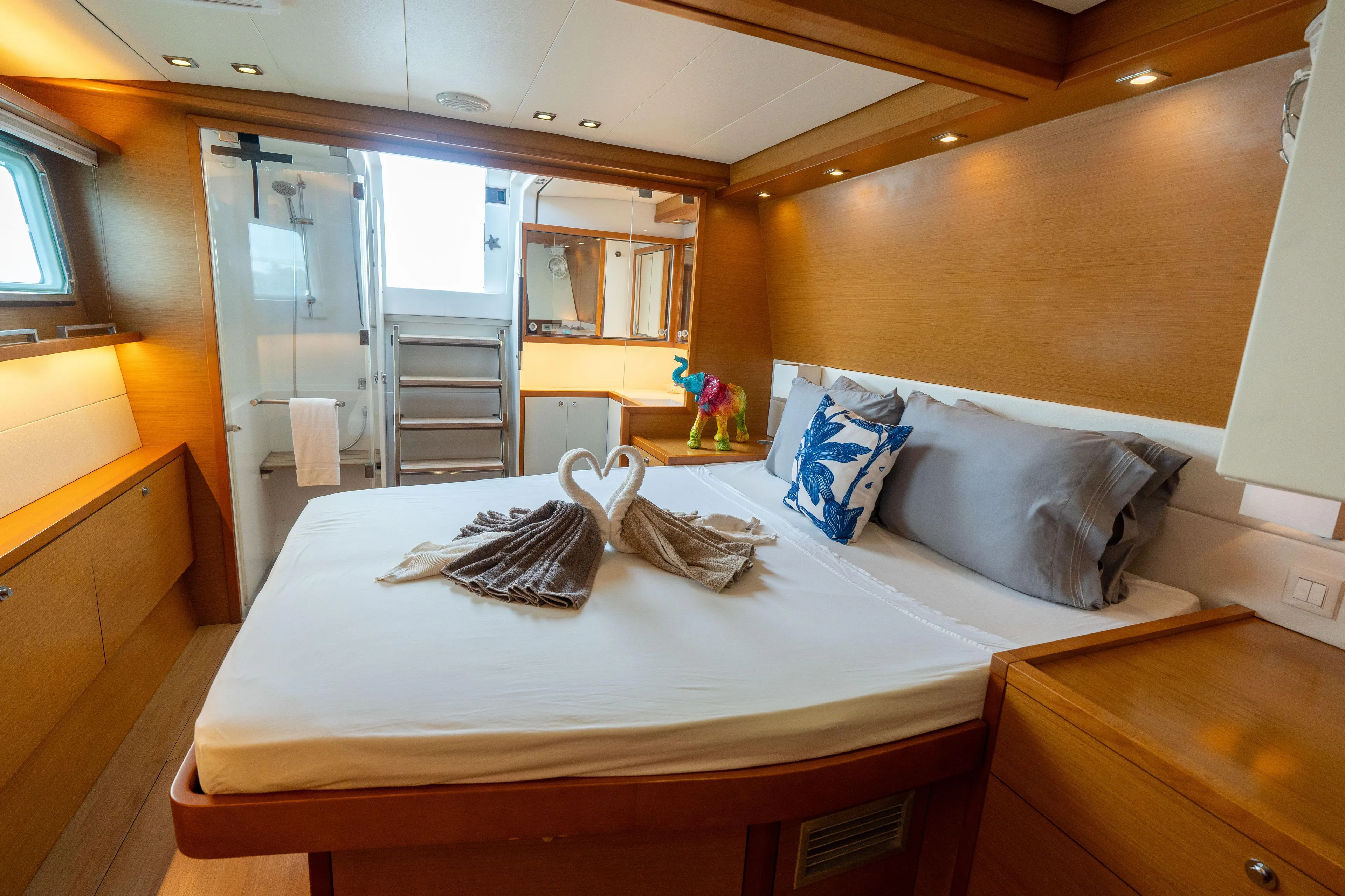 LibertÉ Yacht Photos Pics Luxurious cabin interior of 2011 Lagoon 560 yacht with elegant bedding and modern design.