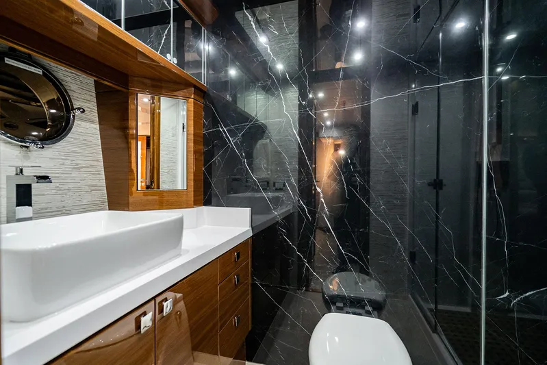  Yacht Photos Pics Luxurious bathroom in 2026 Neptunus 650E yacht with modern fixtures and elegant design.
