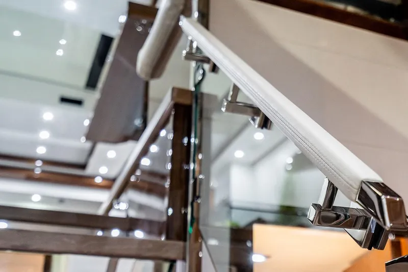  Yacht Photos Pics Modern interior of Neptunus 650E yacht, showcasing sleek railings and elegant design, 2026 model.