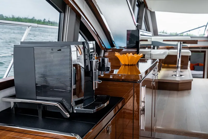  Yacht Photos Pics Luxurious interior of 2026 Neptunus 650E yacht with modern kitchen amenities.