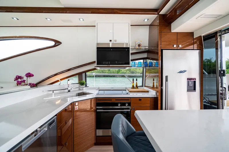  Yacht Photos Pics Luxurious Neptunus 650E 2026 yacht kitchen with modern appliances and sleek design.