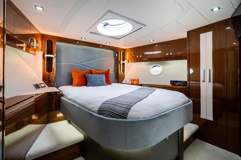  Yacht Photos Pics Luxurious Neptunus 650E 2026 yacht bedroom with modern design and elegant furnishings.