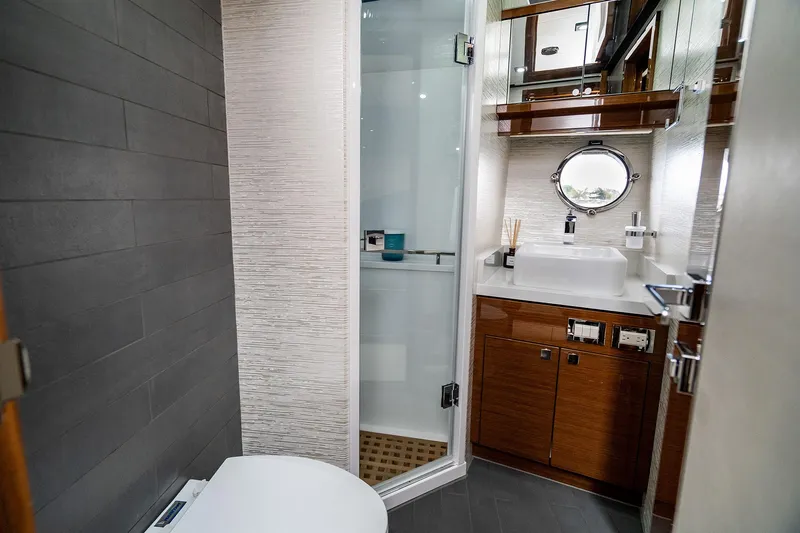  Yacht Photos Pics Luxurious bathroom in 2026 Neptunus 650E yacht with modern fixtures and elegant design.