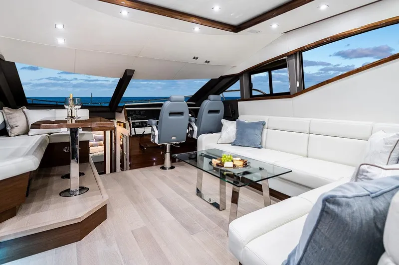  Yacht Photos Pics Luxurious interior of 2026 Neptunus 650E yacht with modern seating and ocean view.