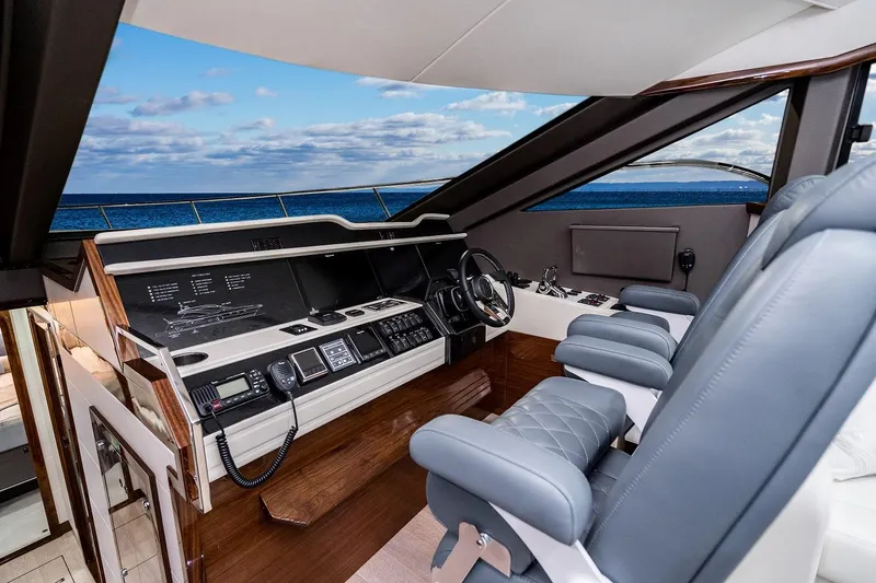  Yacht Photos Pics Luxury helm of 2026 Neptunus 650E yacht with ocean view.