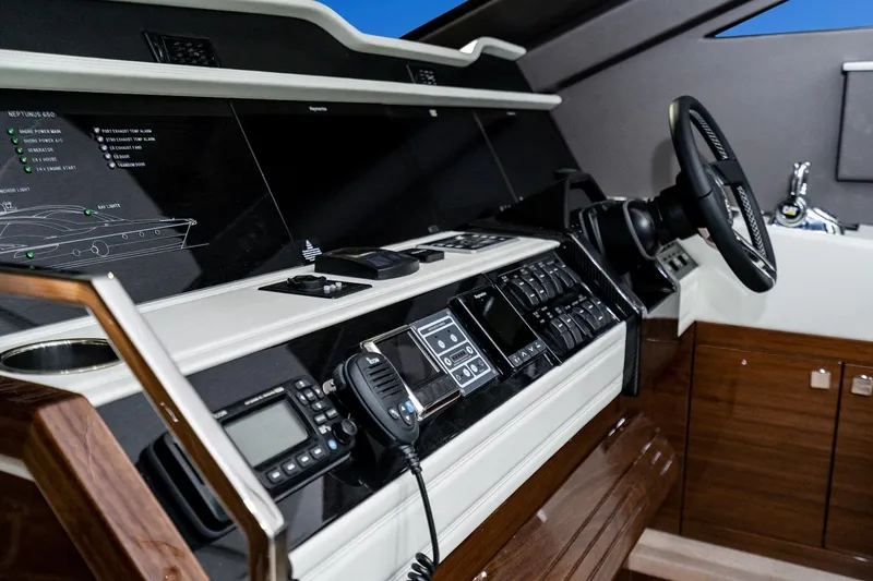  Yacht Photos Pics Luxurious Neptunus 650E 2026 yacht cockpit with advanced navigation controls and sleek design.