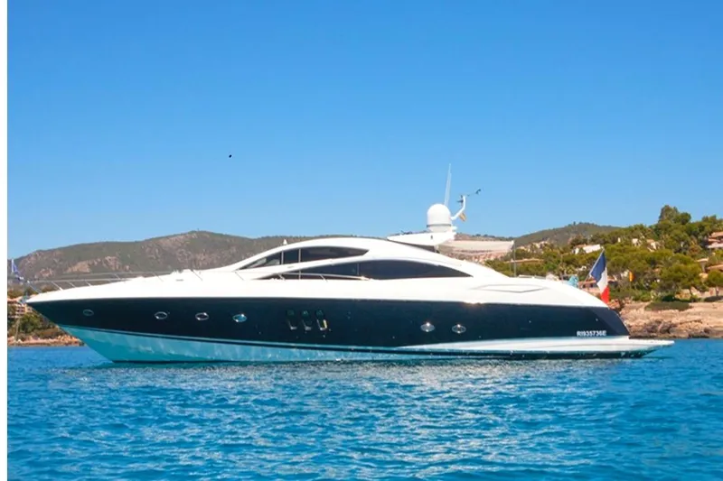 Froggy Yacht Photos Pics 2006 Sunseeker Predator 82 yacht cruising on clear blue waters.