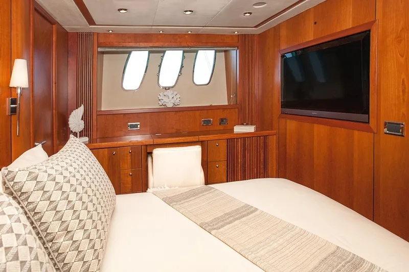 Froggy Yacht Photos Pics Luxurious cabin interior of 2006 Sunseeker Predator 82 yacht with wood paneling and modern amenities.