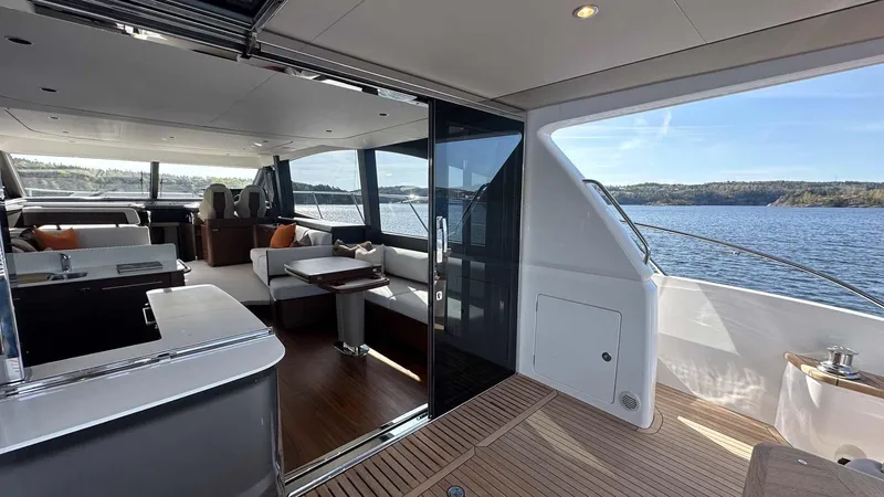 F65012 Yacht Photos Pics Luxurious 2024 Princess F65 yacht interior with elegant seating and scenic ocean view.