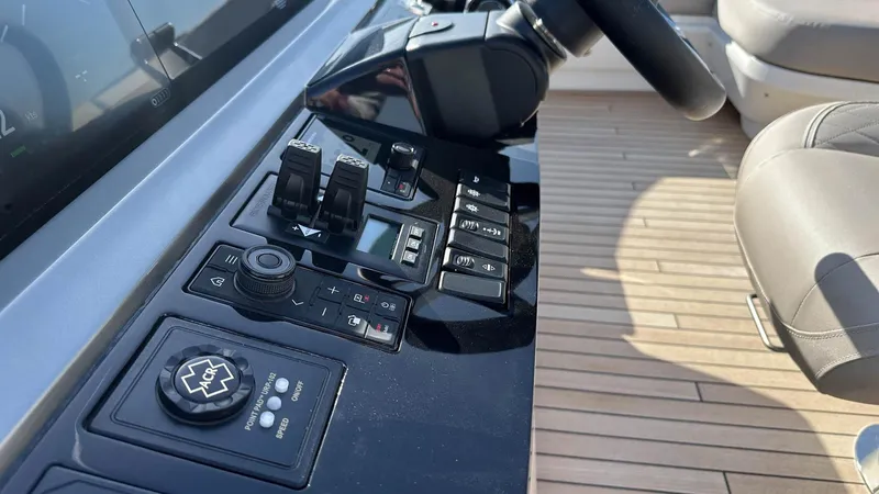 F65012 Yacht Photos Pics Control panel of 2024 Princess F65 yacht with modern navigation equipment.