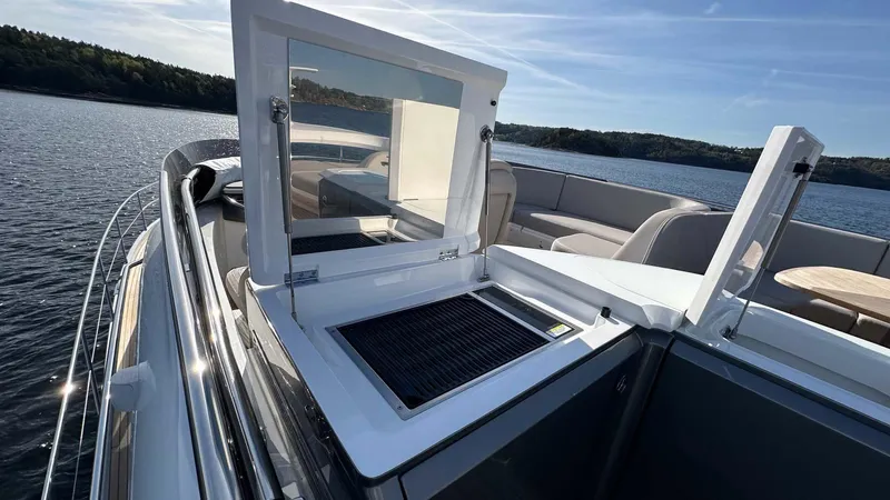 F65012 Yacht Photos Pics 2024 Princess F65 yacht with open deck grill, scenic water view.