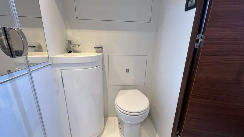 F65012 Yacht Photos Pics Modern bathroom in 2024 Princess F65 yacht with sleek fixtures and compact design.
