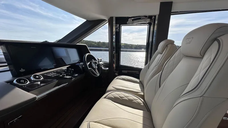 F65012 Yacht Photos Pics Luxurious interior of 2024 Princess F65 yacht with plush seating and modern dashboard.