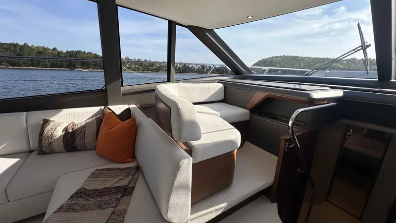 F65012 Yacht Photos Pics Luxurious interior of 2024 Princess F65 yacht with elegant seating and scenic water views.
