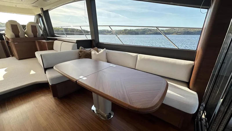 F65012 Yacht Photos Pics Luxurious interior of 2024 Princess F65 yacht with elegant seating and scenic water view.