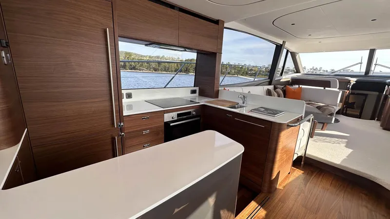 F65012 Yacht Photos Pics Luxurious interior of 2024 Princess F65 yacht with modern kitchen and scenic views.