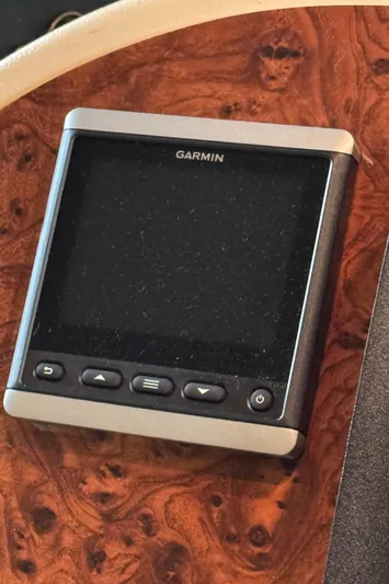  Yacht Photos Pics Garmin device on 2008 Meridian 580 Pilothouse dashboard with wood finish.