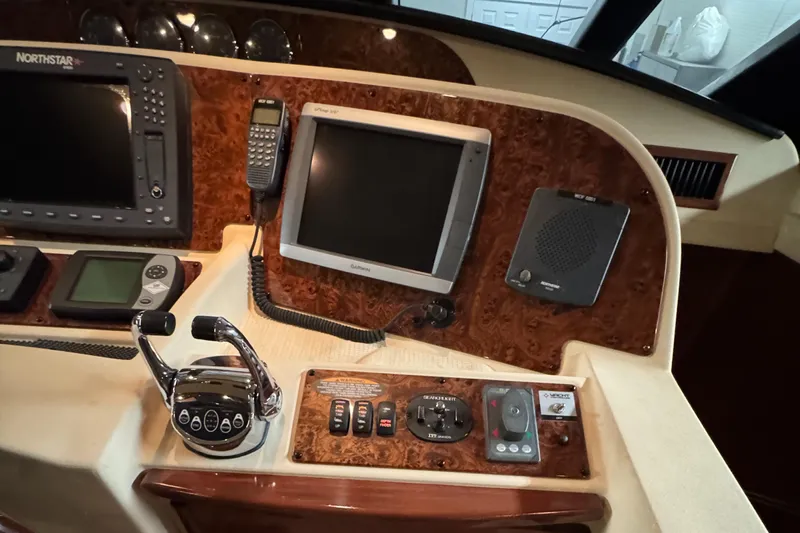  Yacht Photos Pics Control panel of a 2008 Meridian 580 Pilothouse with navigation and communication equipment.