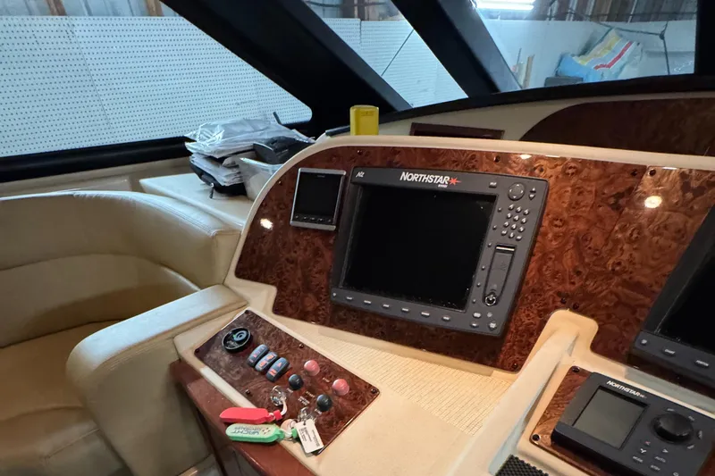  Yacht Photos Pics 2008 Meridian 580 Pilothouse helm with Northstar navigation system and luxurious wood paneling.