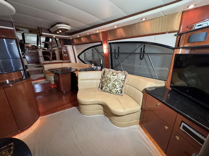  Yacht Photos Pics Luxurious interior of 2008 Meridian 580 Pilothouse yacht with elegant seating and wood finishes.