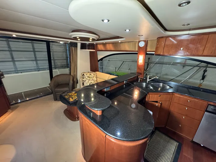  Yacht Photos Pics Luxurious interior of a 2008 Meridian 580 Pilothouse yacht with modern kitchen and seating area.