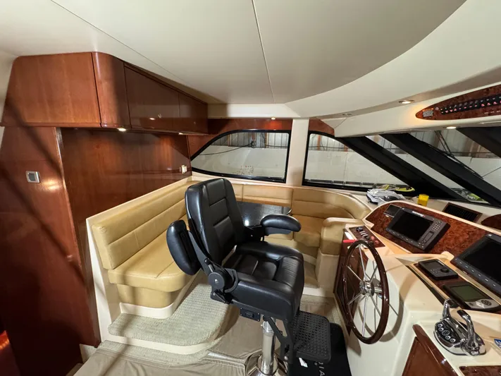  Yacht Photos Pics Pilothouse interior of 2008 Meridian 580 with leather seating and navigation controls.