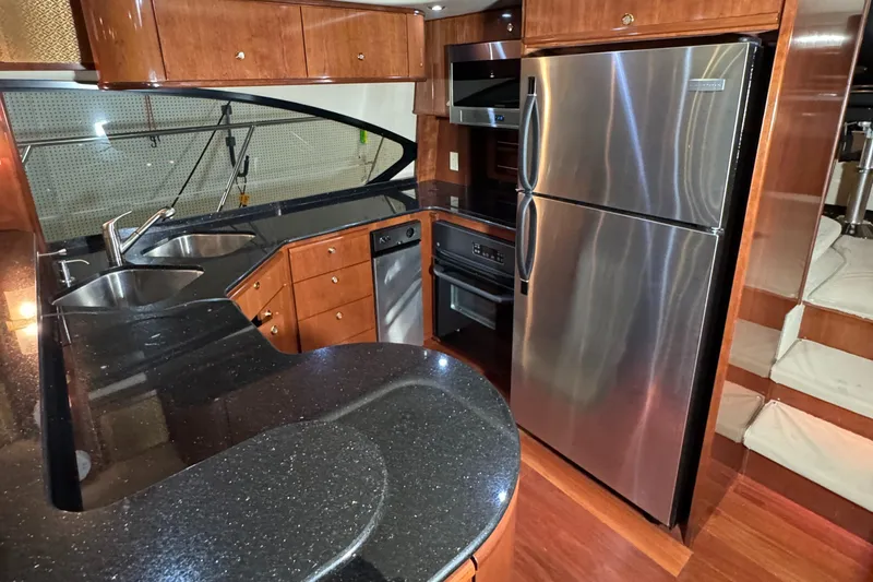  Yacht Photos Pics Luxurious kitchen in 2008 Meridian 580 Pilothouse yacht with modern appliances and sleek countertops.