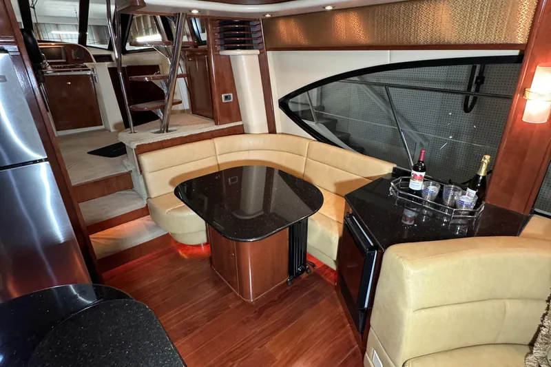  Yacht Photos Pics Luxurious interior of 2008 Meridian 580 Pilothouse yacht with elegant seating and dining area.